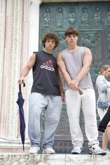 Marco's sons in front of a cathedral door in Italy